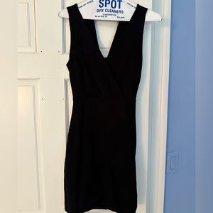 LuLus Black Mini Dress. Crossover front & open detailed back